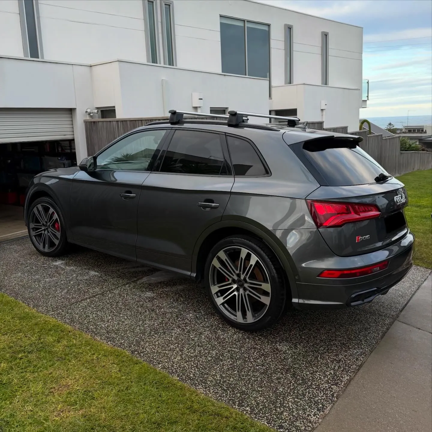 Audi SQ5 rear three-quarter view after a full detail at coastal home